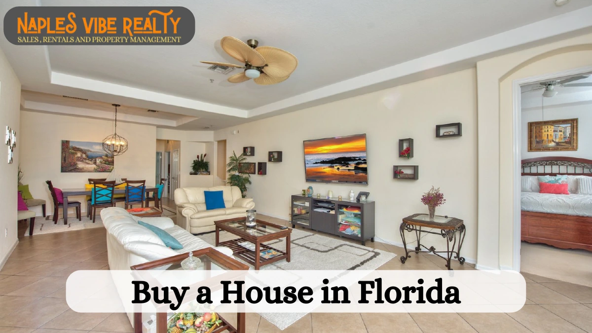 A beautifully designed living room with modern furnishings, a TV displaying a beach sunset, and an open dining area. The image promotes buy a house in Florida with Naples Vibe Realty.